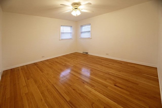 1065 Irwin Ave, Des Plaines, IL 60018 - spare room with ceiling fan, light wood-type flooring, and baseboards