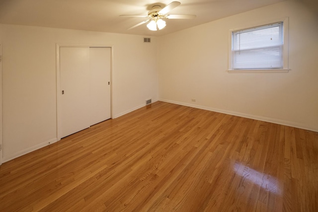 1065 Irwin Ave, Des Plaines, IL 60018 - spare room featuring a ceiling fan, light wood-type flooring, and baseboards