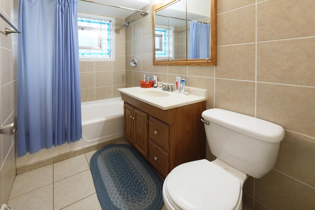 1065 Irwin Ave, Des Plaines, IL 60018 - bathroom with tile walls, vanity, shower / tub combo, toilet, and tile patterned flooring