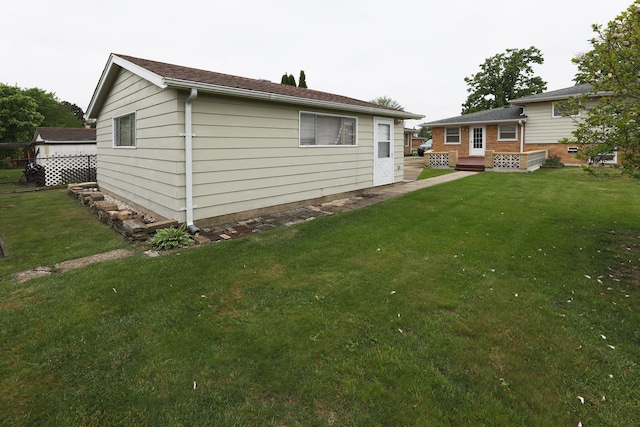 1065 Irwin Ave, Des Plaines, IL 60018 - rear view of property featuring a yard