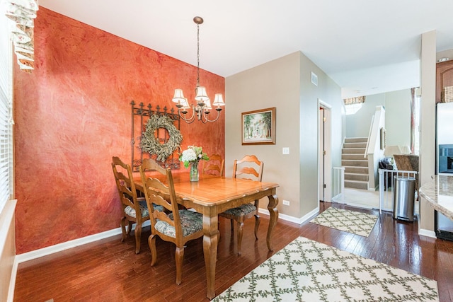 601 Pheasant Trl, Saint Charles, IL 60174 - dining room with a chandelier, stairs, dark wood-type flooring, an accent wall, and baseboards