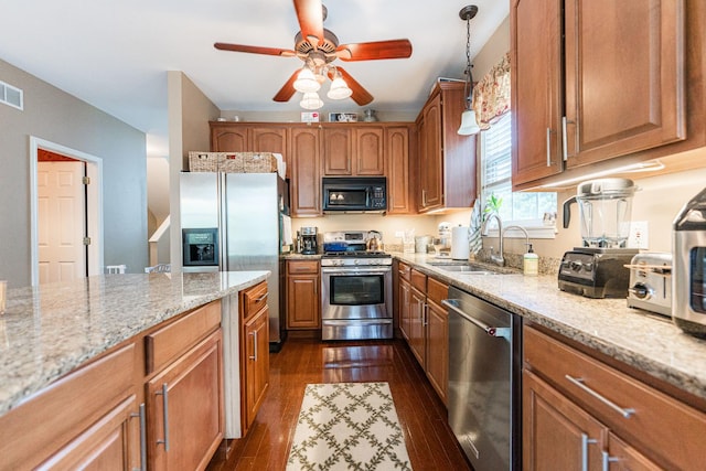 601 Pheasant Trl, Saint Charles, IL 60174 - kitchen with stainless steel appliances, a sink, ceiling fan, dark wood-style floors, and light stone countertops
