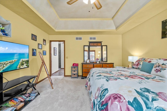 1359 Pine St, Batavia, IL 60510 - bedroom featuring light colored carpet, a tray ceiling, baseboards, and ceiling fan