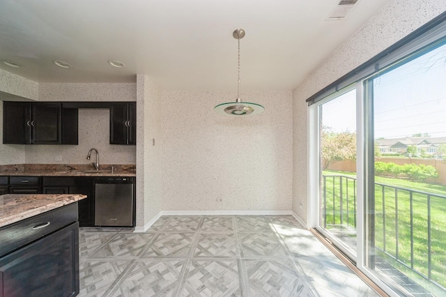 3950 Dundee Rd Unit 101, Northbrook, IL 60062 - kitchen featuring stainless steel dishwasher, plenty of natural light, and dark cabinets