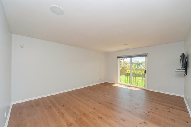 3950 Dundee Rd Unit 101, Northbrook, IL 60062 - unfurnished room featuring baseboards and light wood finished floors