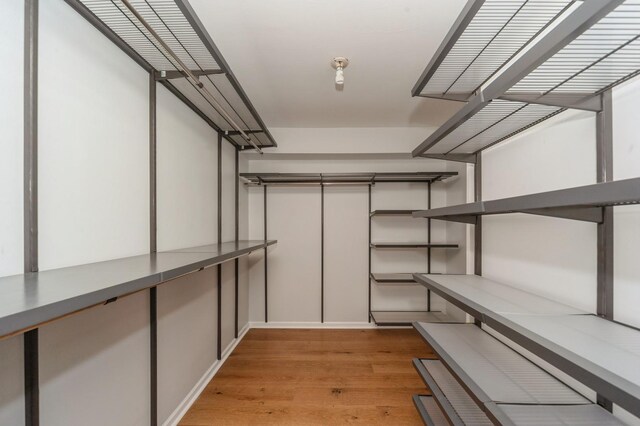 3950 Dundee Rd Unit 101, Northbrook, IL 60062 - walk in closet featuring light wood finished floors