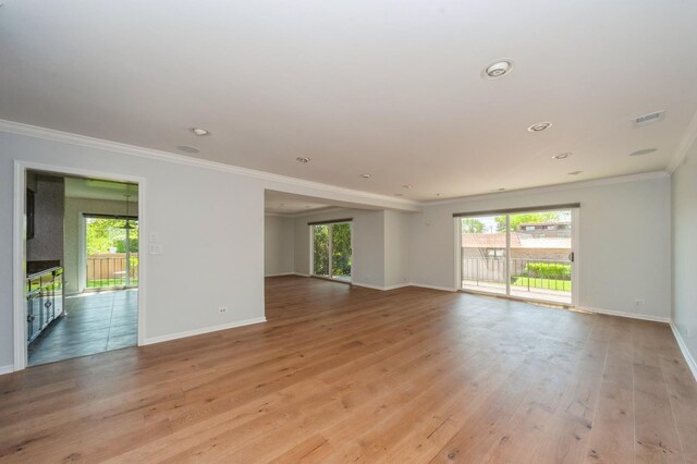 3950 Dundee Rd Unit 101, Northbrook, IL 60062 - spare room with ornamental molding, plenty of natural light, baseboards, light wood-style flooring, and recessed lighting