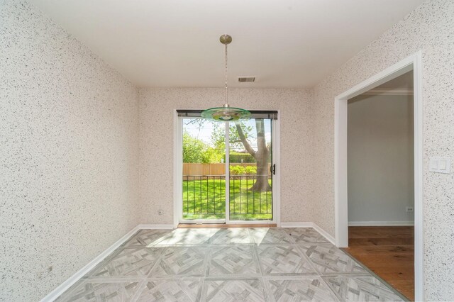 3950 Dundee Rd Unit 101, Northbrook, IL 60062 - unfurnished dining area with baseboards, parquet flooring, and wallpapered walls