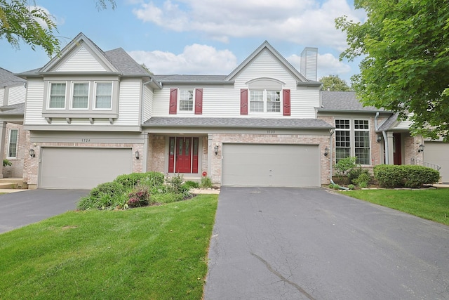 1730 Napoleon Dr, Naperville, IL 60565 - view of front of home with an attached garage, driveway, a chimney, and a front yard