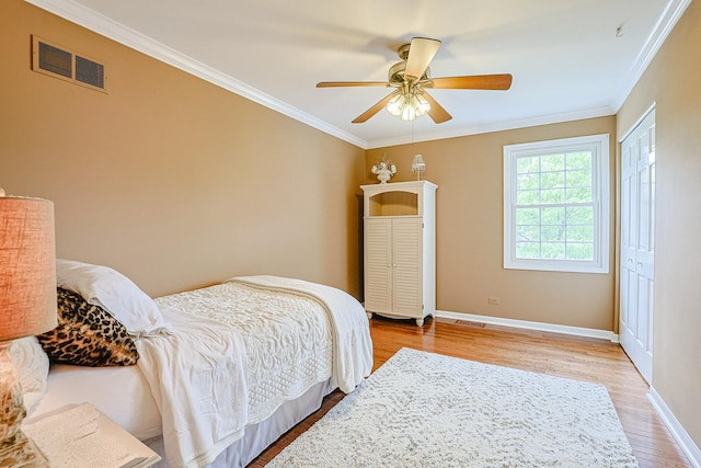 1730 Napoleon Dr, Naperville, IL 60565 - bedroom with light wood finished floors, ornamental molding, baseboards, a closet, and a ceiling fan