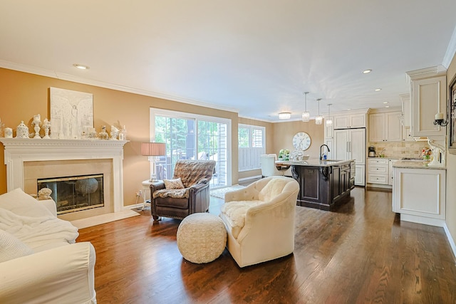 1730 Napoleon Dr, Naperville, IL 60565 - living area featuring crown molding, dark wood-style floors, recessed lighting, a glass covered fireplace, and baseboards