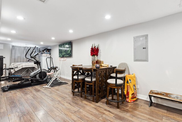 4331 S Evans Ave, Chicago, IL 60653 - workout area with electric panel, wood finished floors, baseboards, recessed lighting, and a bar