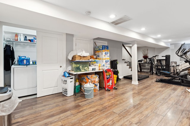 4331 S Evans Ave, Chicago, IL 60653 - workout room with wood finished floors, washer / dryer, and recessed lighting