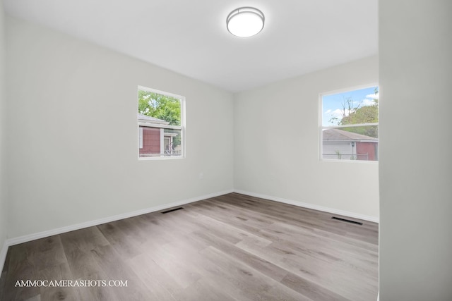1306 Schriber Ave, Joliet, IL 60435 - unfurnished room featuring wood finished floors and baseboards
