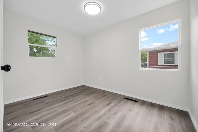 1306 Schriber Ave, Joliet, IL 60435 - spare room with baseboards and wood finished floors