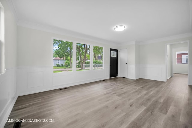 1306 Schriber Ave, Joliet, IL 60435 - unfurnished room with crown molding, wainscoting, and wood finished floors