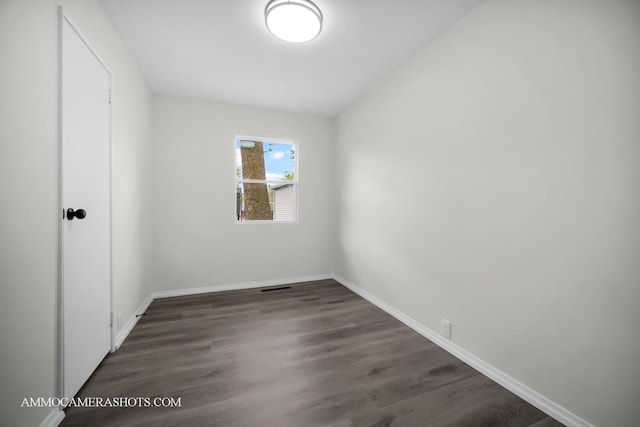 1306 Schriber Ave, Joliet, IL 60435 - unfurnished bedroom with baseboards and wood finished floors