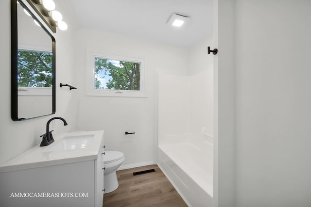 1306 Schriber Ave, Joliet, IL 60435 - full bath with toilet, healthy amount of natural light, vanity, and wood finished floors