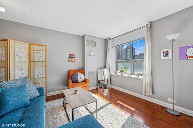 474 N Lake Shore Dr Unit 1701, Chicago, IL 60611 - living room featuring wood finished floors, a textured ceiling, and baseboards