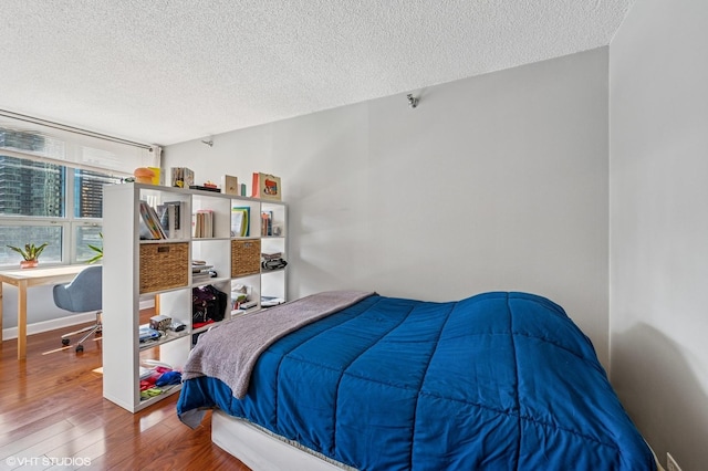 474 N Lake Shore Dr Unit 1701, Chicago, IL 60611 - bedroom with wood finished floors, a textured ceiling, and a desk