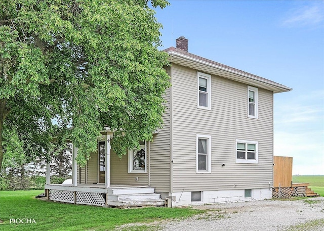 32900 N 2000 E Rd, Dwight, IL 60420 - back of house featuring a chimney and a yard