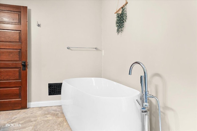32900 N 2000 E Rd, Dwight, IL 60420 - bathroom with a soaking tub and baseboards