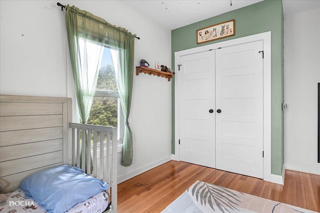 32900 N 2000 E Rd, Dwight, IL 60420 - bedroom featuring wood finished floors, baseboards, and a closet