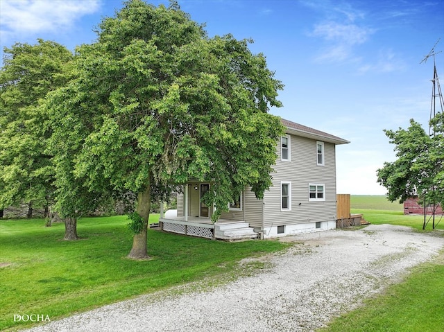32900 N 2000 E Rd, Dwight, IL 60420 - view of side of home featuring a lawn, covered porch, and gravel driveway