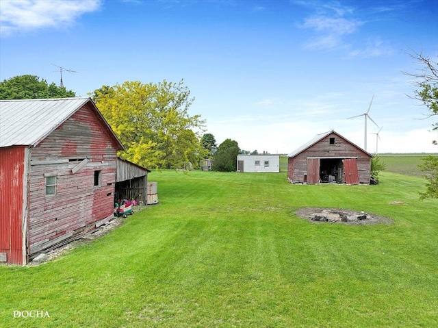 32900 N 2000 E Rd, Dwight, IL 60420 - view of green lawn featuring a barn, an outbuilding, and a pole building