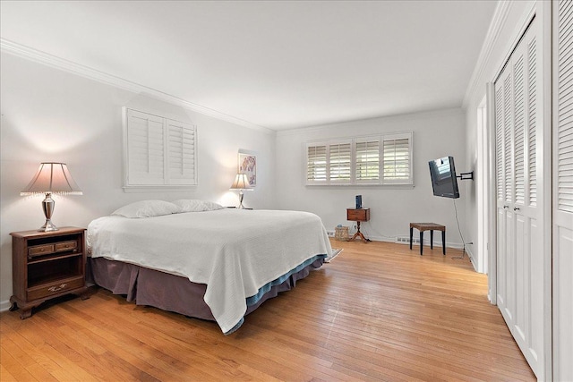 20424 Ithaca Rd, Olympia Fields, IL 60461 - bedroom featuring light wood-style floors, crown molding, a closet, and baseboards