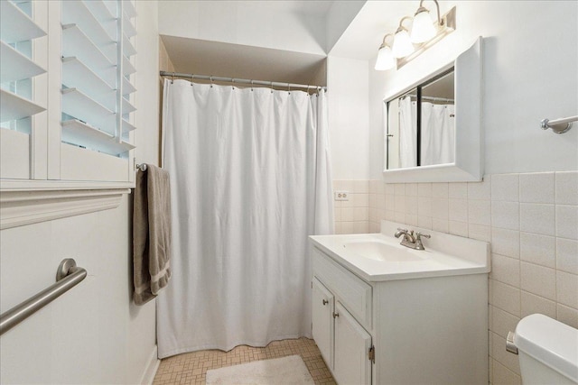 20424 Ithaca Rd, Olympia Fields, IL 60461 - bathroom with tile walls, vanity, toilet, a shower with curtain, and wainscoting