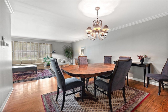 20424 Ithaca Rd, Olympia Fields, IL 60461 - dining space with a chandelier, wood finished floors, ornamental molding, and baseboards