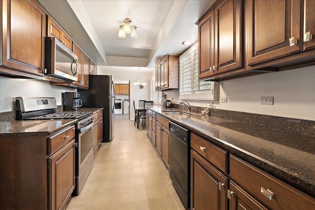 20424 Ithaca Rd, Olympia Fields, IL 60461 - kitchen featuring stainless steel appliances, independent washer and dryer, a sink, a raised ceiling, and dark stone countertops
