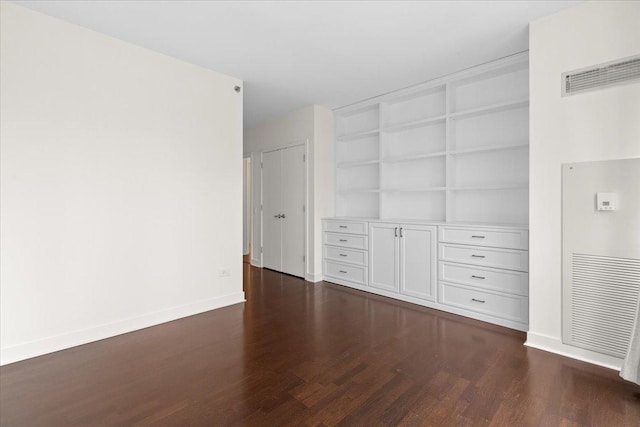 505 N Mcclurg Ct Unit 2003, Chicago, IL 60611 - unfurnished living room with dark wood-type flooring, built in shelves, and baseboards