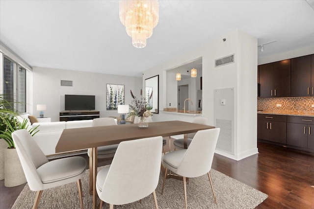 505 N Mcclurg Ct Unit 2003, Chicago, IL 60611 - dining area with dark wood finished floors, a chandelier, and baseboards
