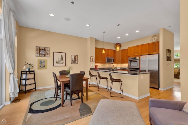 2862 N Paulina St, Chicago, IL 60657 - dining area featuring light wood-style flooring, recessed lighting, and baseboards
