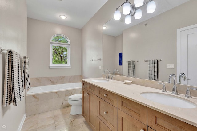 2862 N Paulina St, Chicago, IL 60657 - bathroom featuring double vanity, a bath, toilet, tile patterned flooring, and baseboards