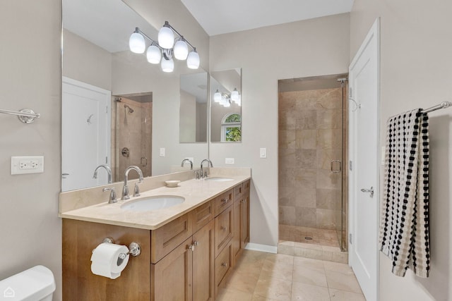 2862 N Paulina St, Chicago, IL 60657 - bathroom with a stall shower, double vanity, toilet, and baseboards
