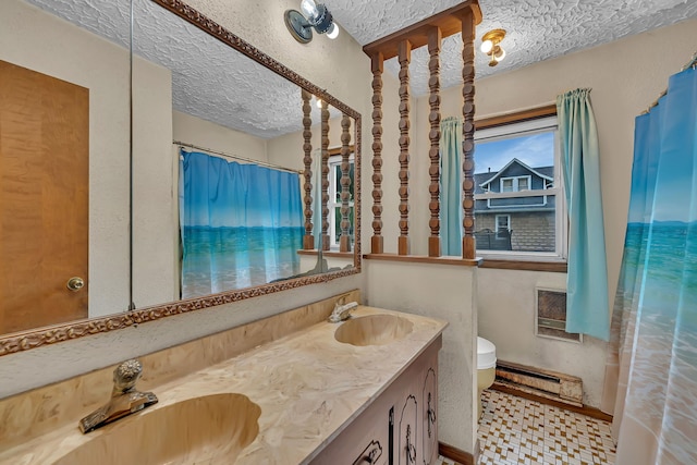 170 E Church St, Coal City, IL 60416 - full bathroom featuring a baseboard radiator, double vanity, a textured ceiling, and a shower with curtain