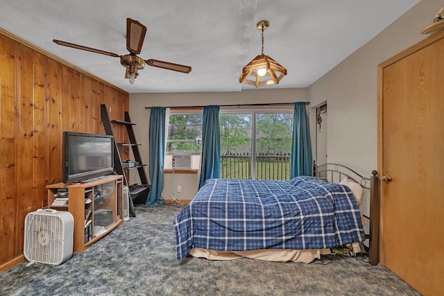 170 E Church St, Coal City, IL 60416 - carpeted bedroom with wood walls, cooling unit, access to outside, and a ceiling fan