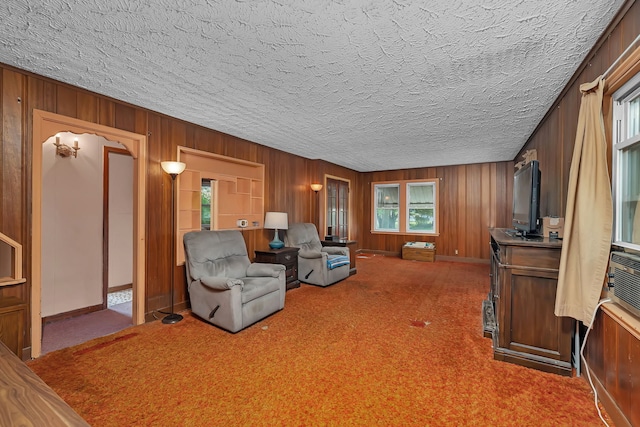 170 E Church St, Coal City, IL 60416 - carpeted living room featuring wooden walls and a textured ceiling