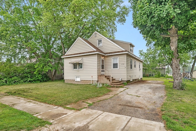 170 E Church St, Coal City, IL 60416 - view of front of house featuring a front yard and asphalt driveway