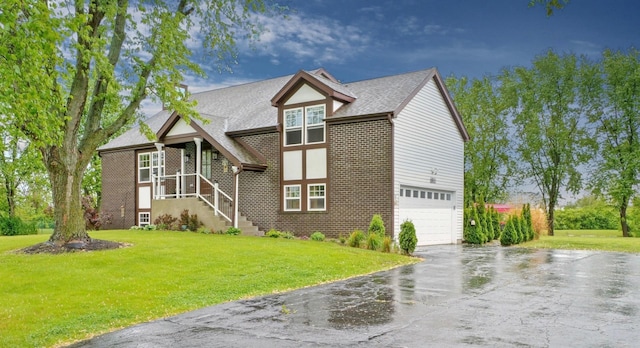 500 Muscovy Ln, Bloomingdale, IL 60108 - english style home featuring asphalt driveway, an attached garage, brick siding, and a front yard