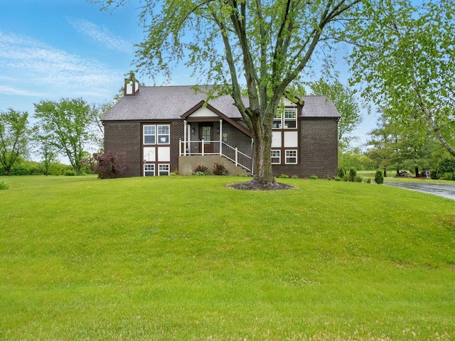 500 Muscovy Ln, Bloomingdale, IL 60108 - view of front facade featuring brick siding, a front yard, and a chimney