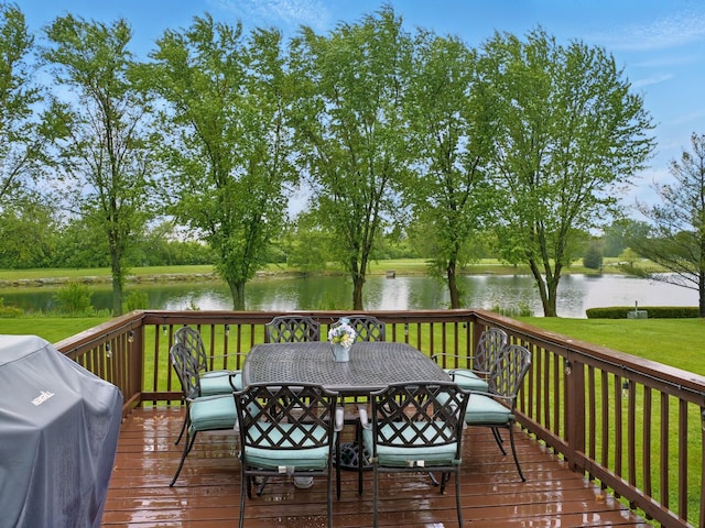 500 Muscovy Ln, Bloomingdale, IL 60108 - deck with a grill, a water view, a lawn, and outdoor dining space