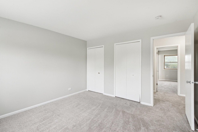 18951 Willow Ave, Country Club Hills, IL 60478 - unfurnished bedroom with two closets, carpet floors, and baseboards