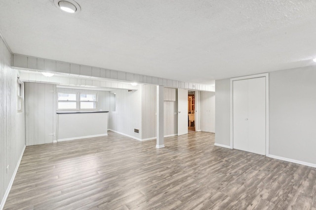 18951 Willow Ave, Country Club Hills, IL 60478 - below grade area with wood finished floors, a textured ceiling, and baseboards