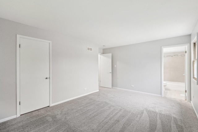 18951 Willow Ave, Country Club Hills, IL 60478 - unfurnished bedroom with carpet floors, baseboards, and ensuite bathroom