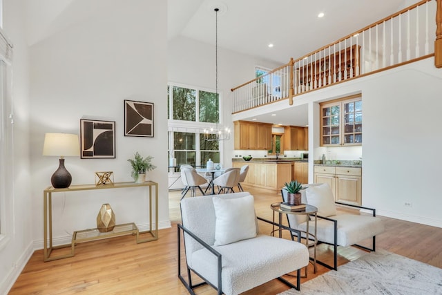 1700 Cornell Ct, Lake Forest, IL 60045 - living area featuring a high ceiling, light wood finished floors, baseboards, a chandelier, and recessed lighting