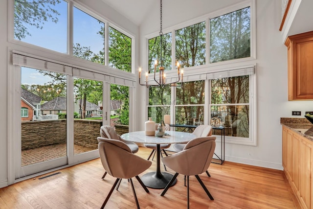 1700 Cornell Ct, Lake Forest, IL 60045 - sunroom featuring healthy amount of natural light and a chandelier